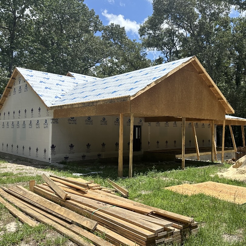 New home under construction with roof sheathing installed